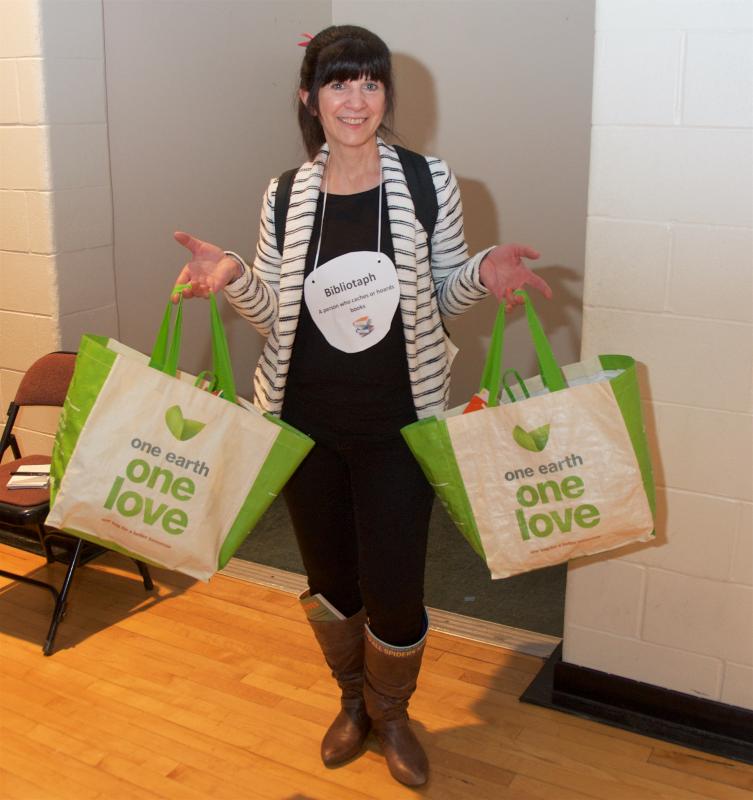 With a backpack, two shopping bags and boots full of books, Principal Lyn Rivet embodies a bibliotaph, a person who hoards books. BY GEORGIA SPARLING